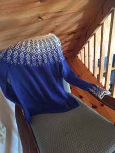 C Popovic sweater on chair